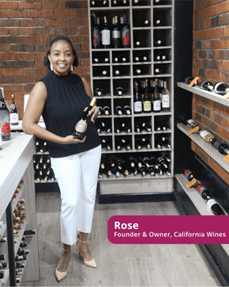 Rose holding wine bottle in wine shop